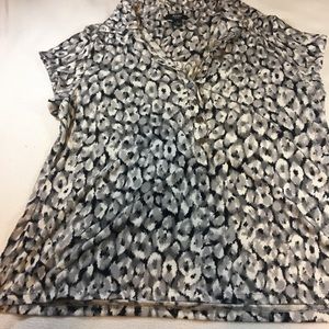 Animal print blouse with silver button accents